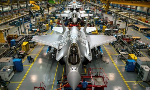 Futuristic airplanes being built at modern aerospace factory, military aircrafts are in assembly shop of plant. Concept of plane, industry, manufacturing, fighter, machinery, war. Generative AI